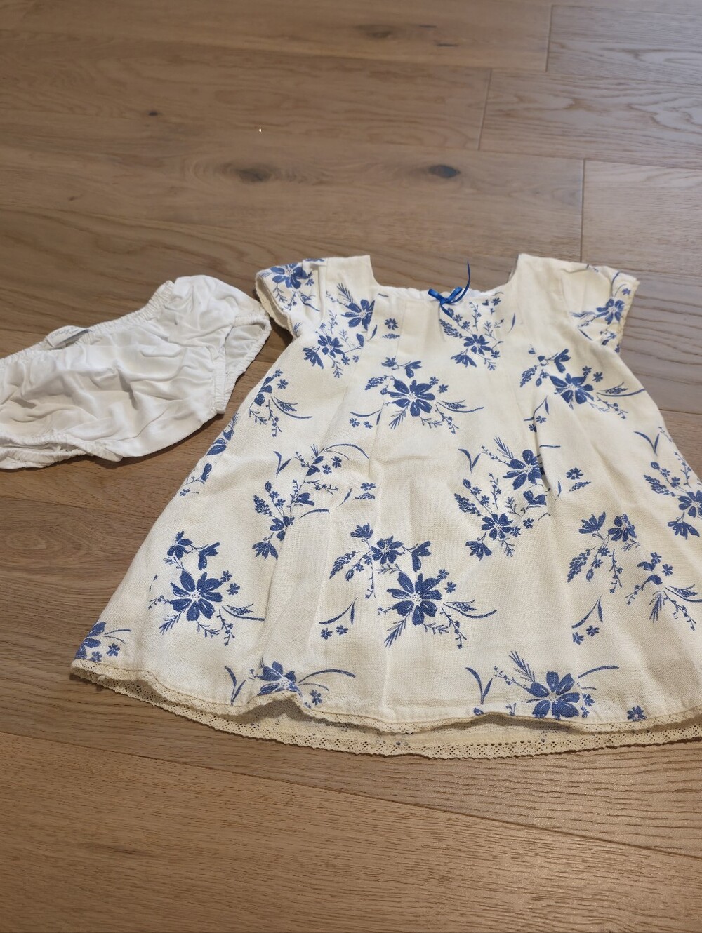 Pioppa Girls' White Dress with Blue Floral Print